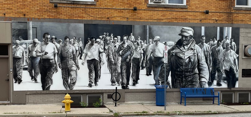 Windsor Ontario mural "Shift Change". Black & white mural of workers leaving Ford plant